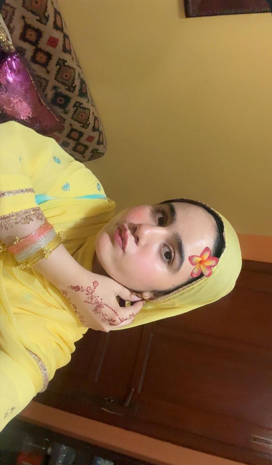 Sharmeen dressed in yellow